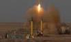 Iran test-fires missiles, sinks warship-sized target