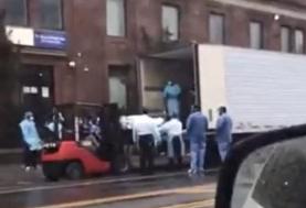 Coronavirus: Hospital worker shares video of bodies being loaded into huge trucks in New York as ...