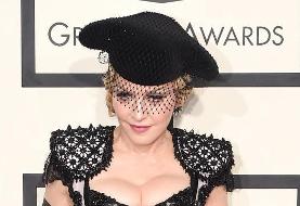 Madonna poses topless in gold corset in series of wild photos