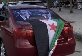 نصب تصویر صدام حسین در خیابان‌های سوریه